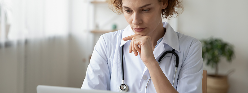 Woman watching webinar on laptop